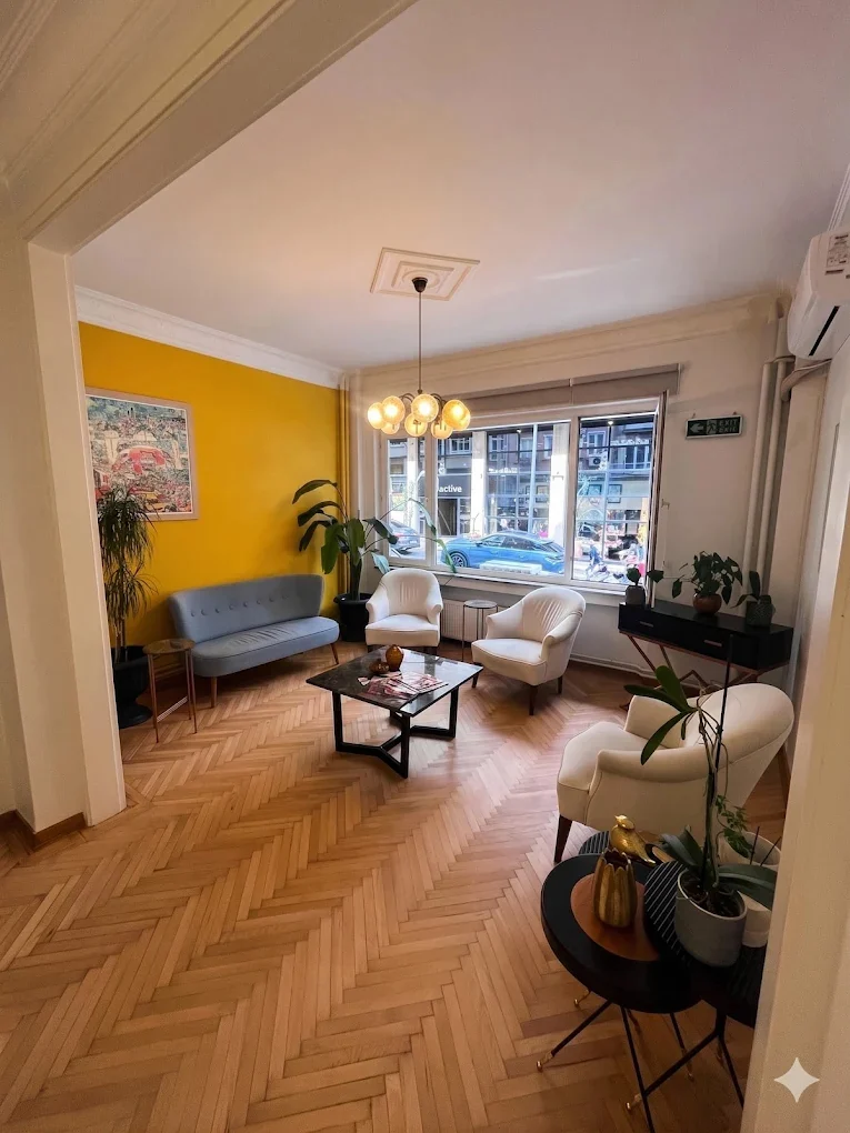 Patient lounge at GC Clinic Nişantaşı — herringbone parquet and street view